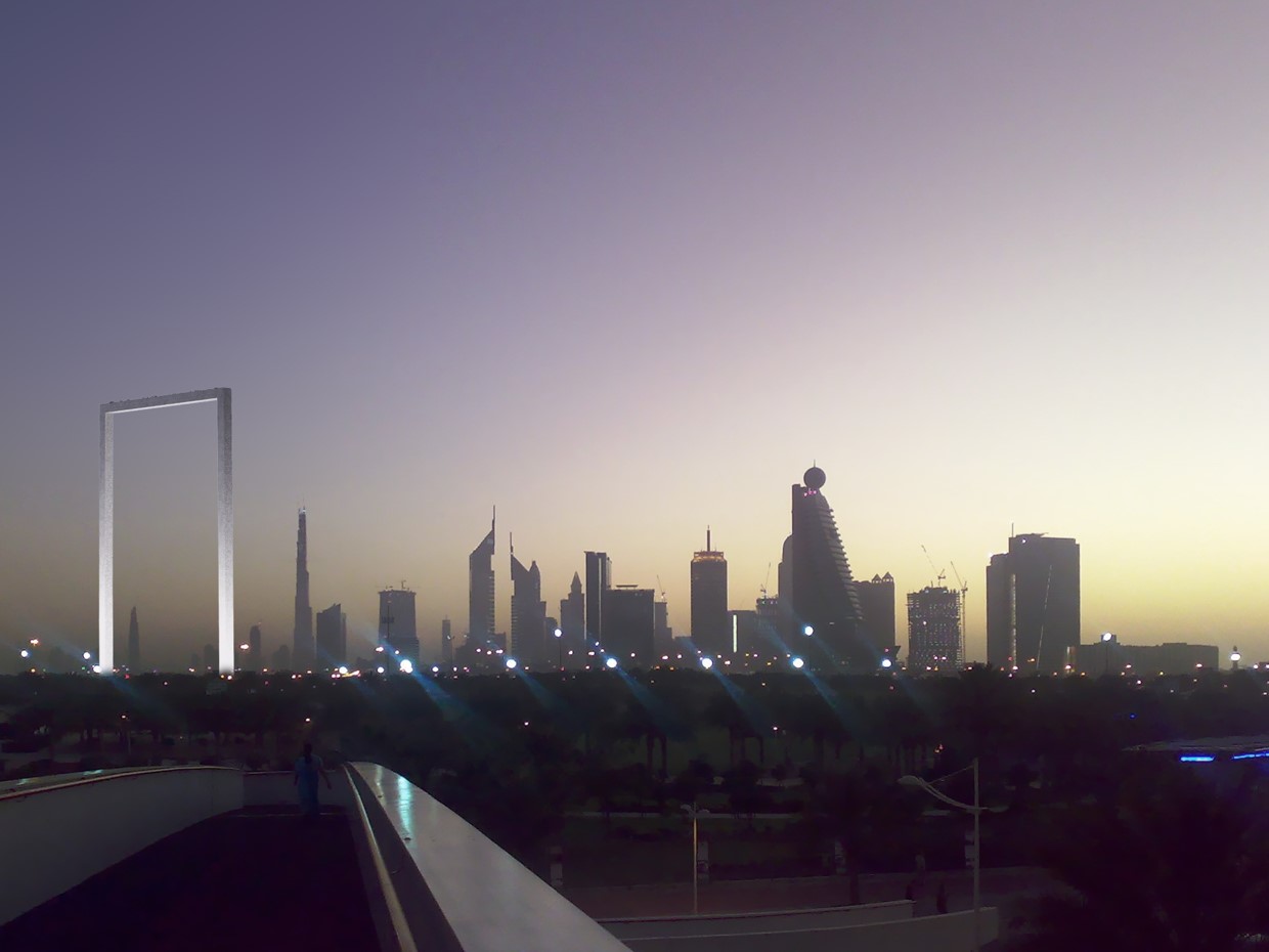 Dubai skyline beside the water at dusk