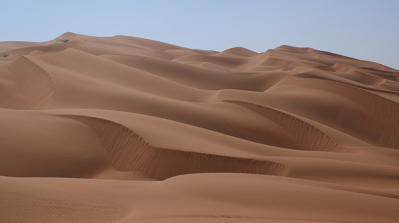 Palm-filled oasis surrounded by the dunes of Liwa